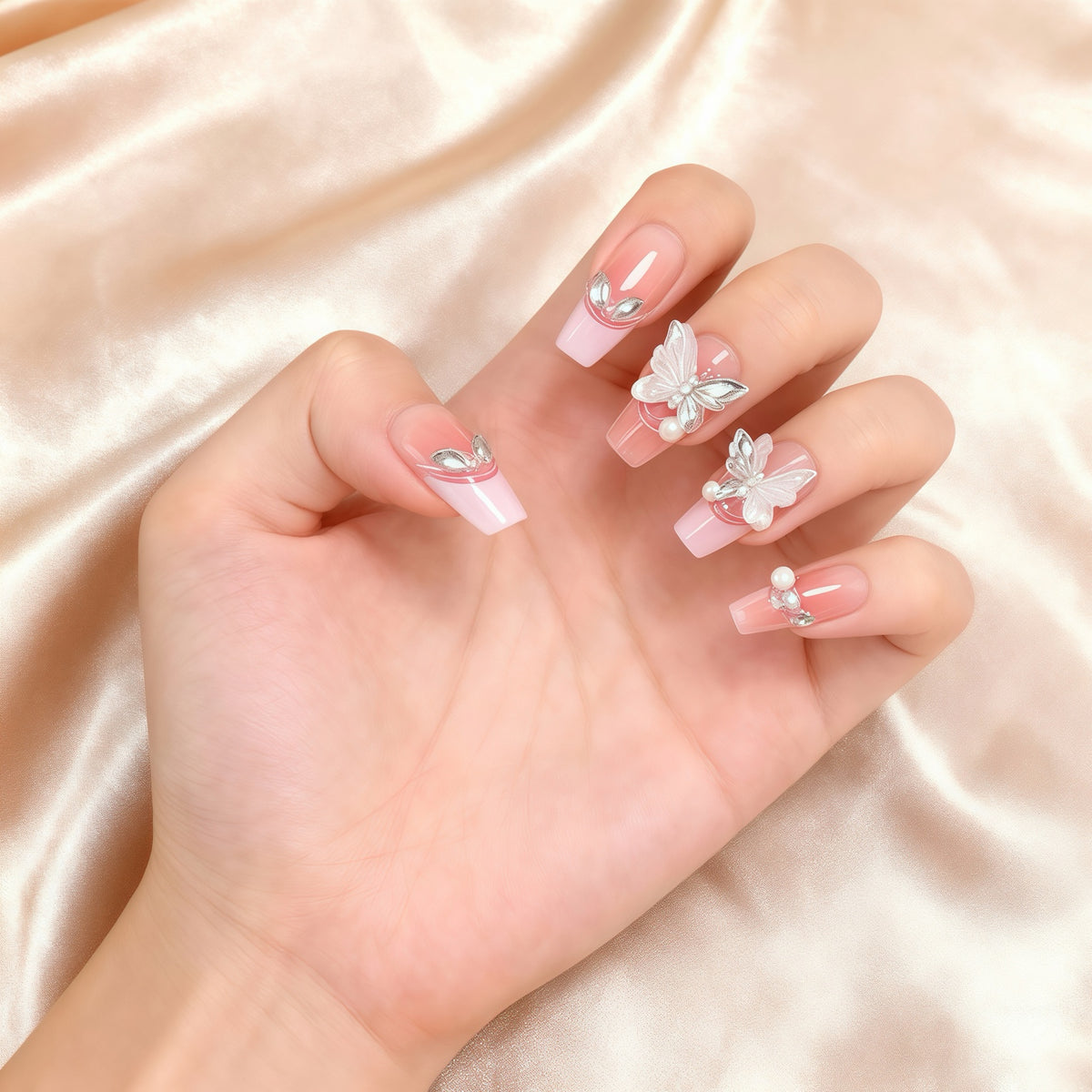 Blush Butterfly pink press-on nails with decorative butterfly accents