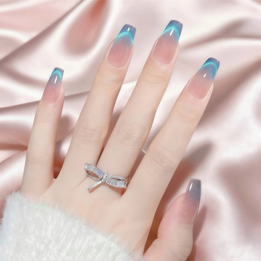 Midnight Aura press-on nails with blue-toned gradient tips